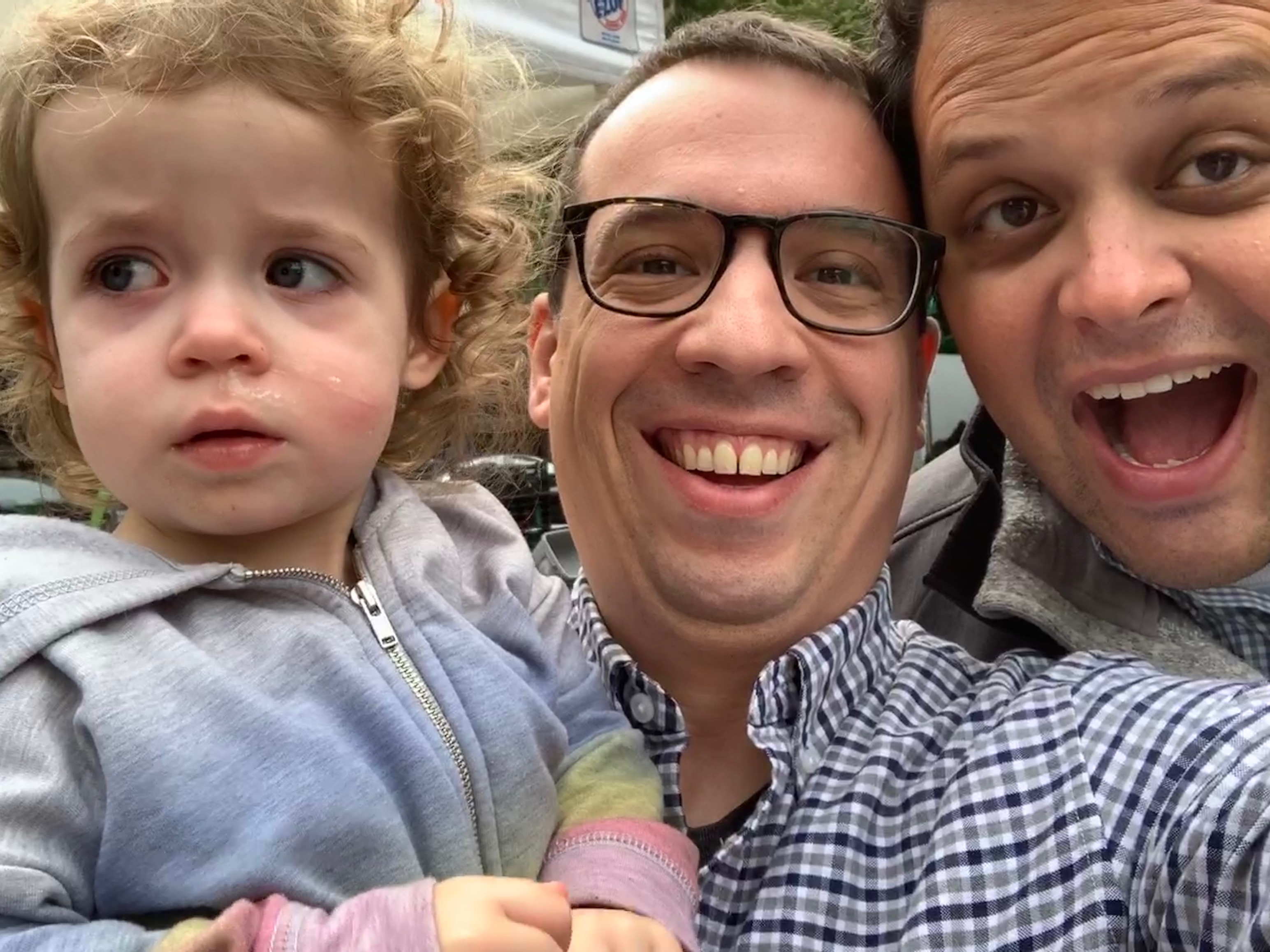Two men and a toddler girl