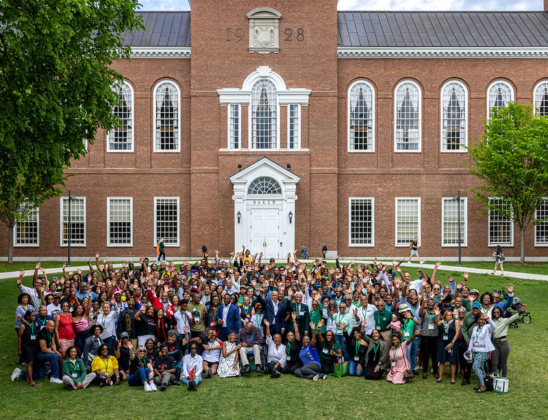 Group photo of all attendees at the BADA reunion celebration in front of Baker Tower