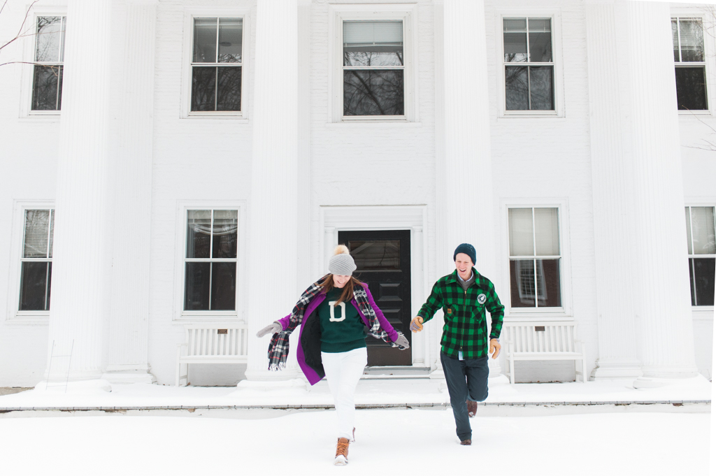 Kate Lyon and Chris Bustard running in front of Dartmouth Hall