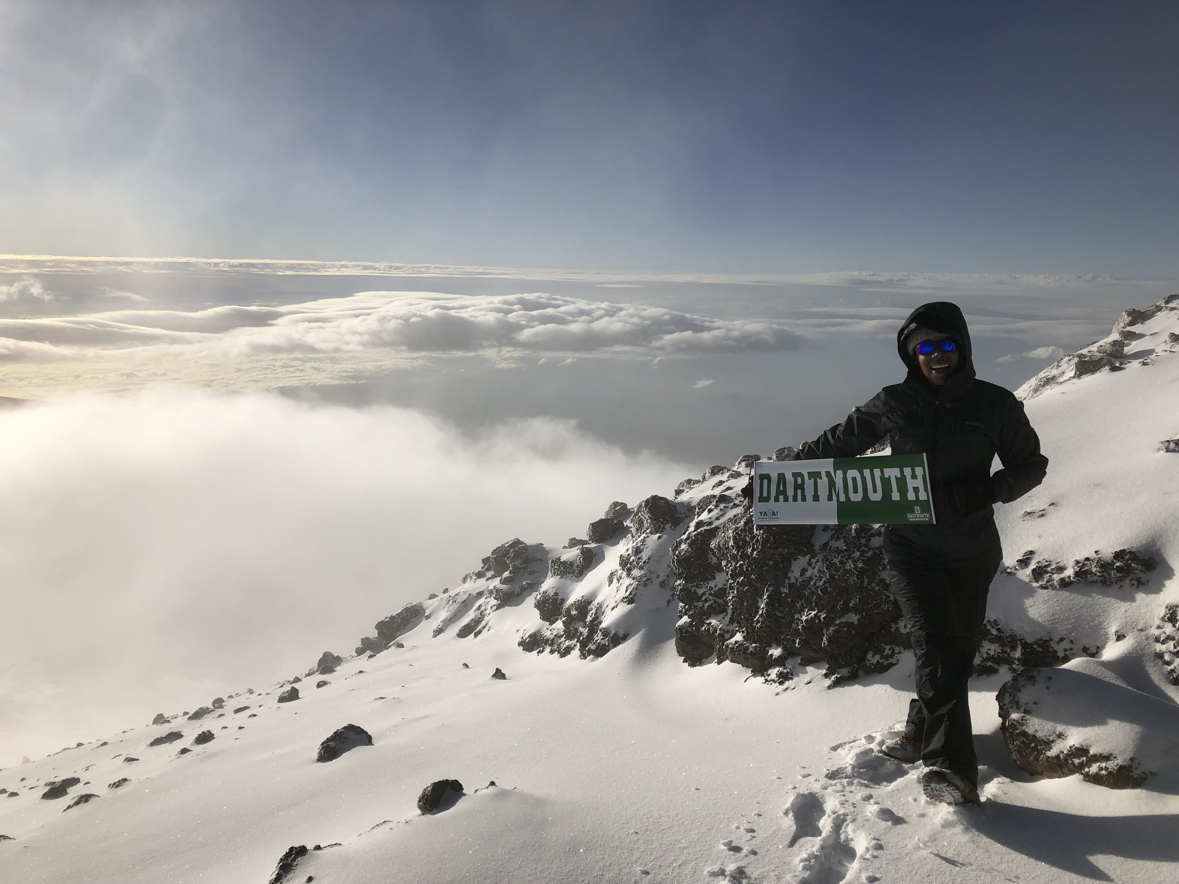 Lisa Caldeira atop Mt. Kilimanjaro