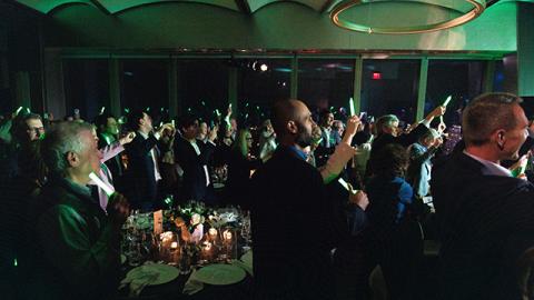 A group of people standing and celebrating at the Entrepreneurs Hall of Fame event 