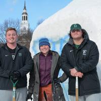 Students work on the Winter Carnival Snow Sculpture